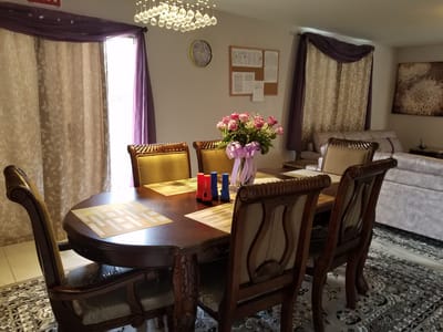 Dining area with a table and decorative flowers
