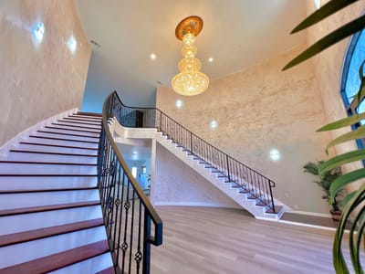 Elegant interior staircase with chandelier