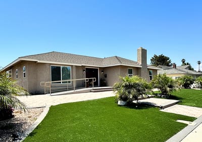 Exterior view of the facility with landscaped garden