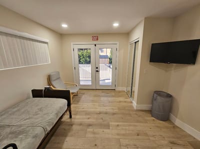 Bright interior space with seating and door to outside