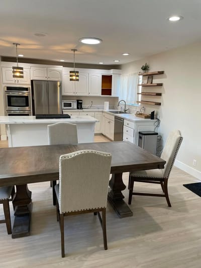 Bright and modern kitchen space with dining table