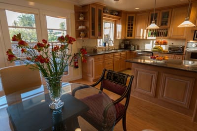Bright, modern kitchen with flowers and fruit