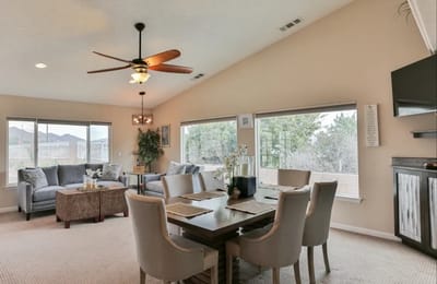 Bright common area with seating and dining table