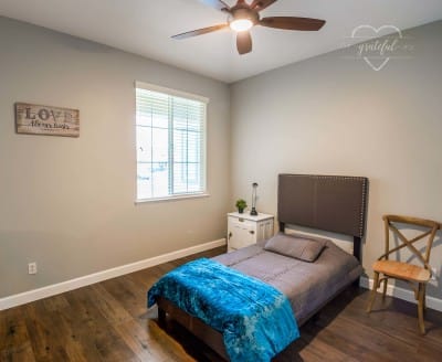 Private bedroom with a simple bed and decor