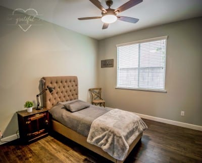 Cozy interior of a private resident room with a bed