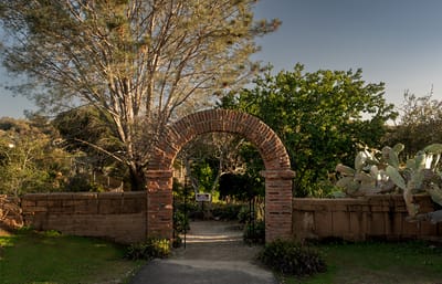 Entrance to a garden area with brick archway