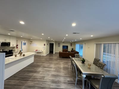 Interior view of a common area with seating and dining table