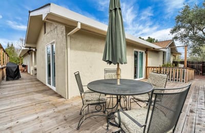 Outdoor patio area with table and chairs