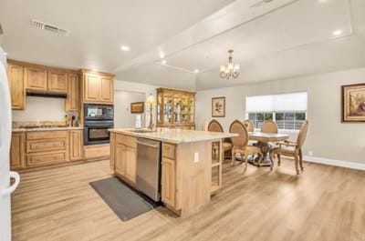 Bright and spacious dining area with wooden furniture