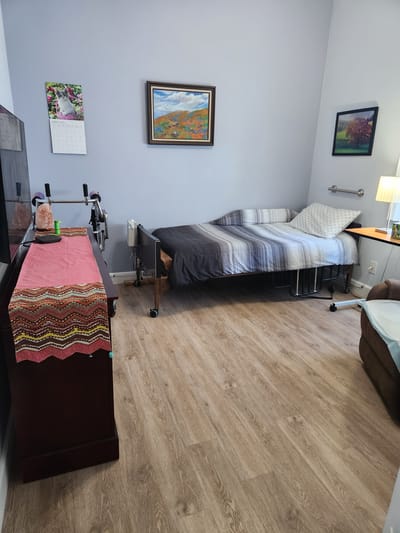 Private resident room with a bed and decorations