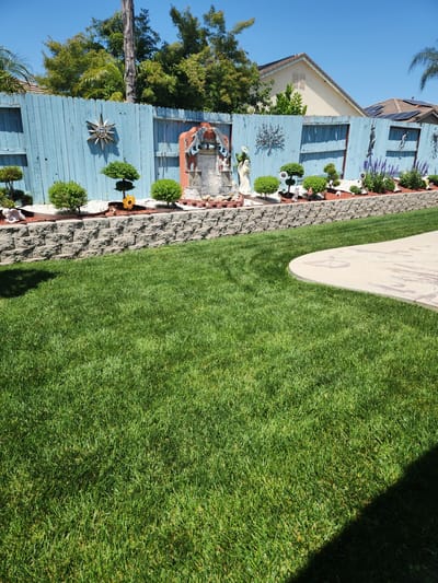 Well-maintained garden area with decorative elements