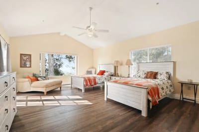 Bright, spacious interior of a resident room with two beds