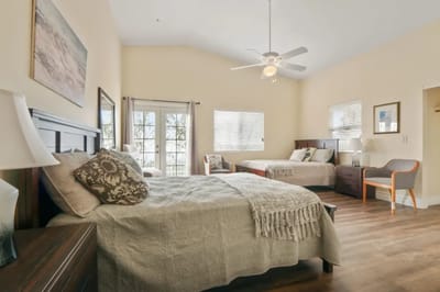 A well-furnished resident room with a cozy atmosphere