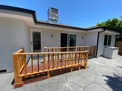 Exterior view of the facility with a wooden ramp