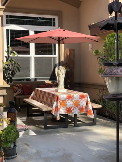 Outdoor patio table with umbrella and decorations