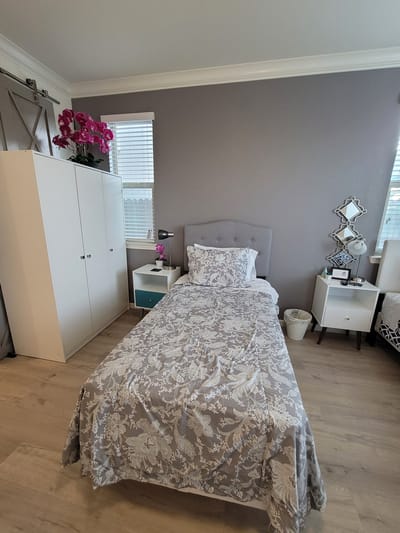Cozy private resident room with floral bedding