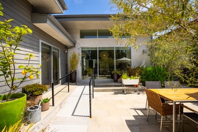 Outdoor seating area with plants and patio