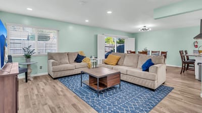 Bright common area with comfortable seating and dining table