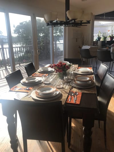 Dining table set with plates and flowers