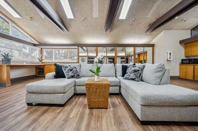 Cozy common area with a sectional couch and table