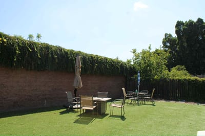 Outdoor seating area with tables and umbrellas