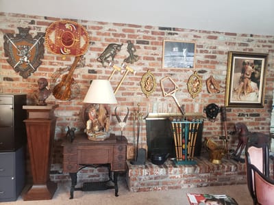 Decorative wall with various artifacts and sculptures