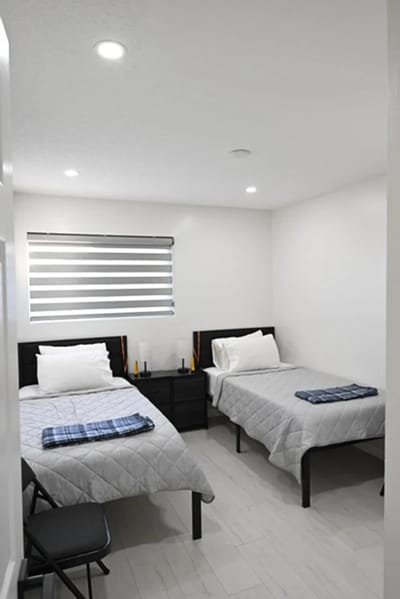 Interior view of a shared residential room with two beds