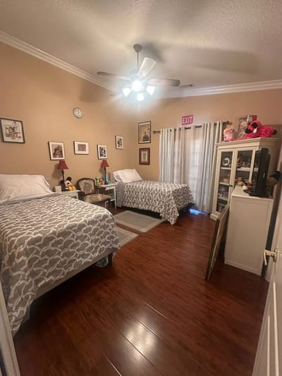 Cozy resident room with two beds and decor