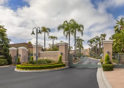 Exterior view of La Costa Glen entrance with palm trees