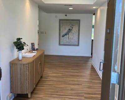 Bright, spacious interior hallway with artwork