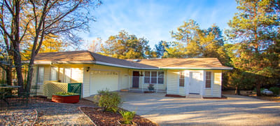 Exterior view of a residential style building with trees