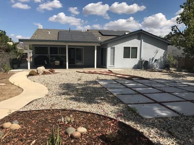 Exterior view of a residential facility with a garden