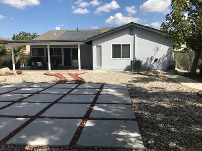 Exterior view of a facility building and garden area