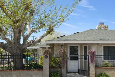 Exterior view of a residential care facility with landscaping