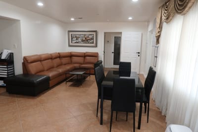 Interior view of a common area with seating and dining table