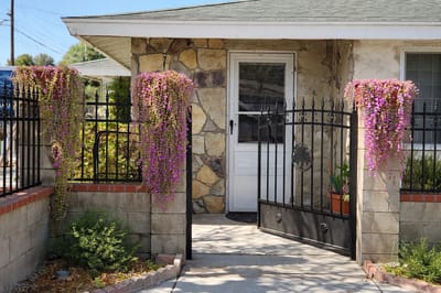 Entrance with flowered vine decor at a senior living facility