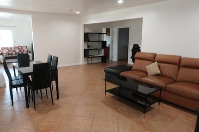 Bright interior common area with seating and dining table
