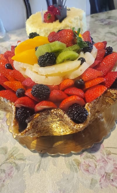 A vibrant fruit tart displaying various fresh fruits