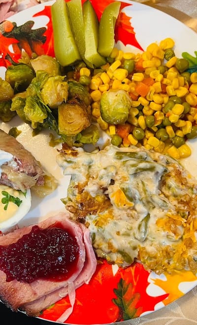 A plate of food featuring vegetables and meats
