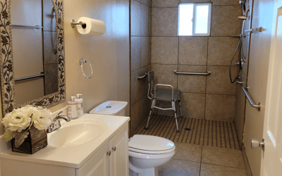 Accessible bathroom with grab bars and shower seat