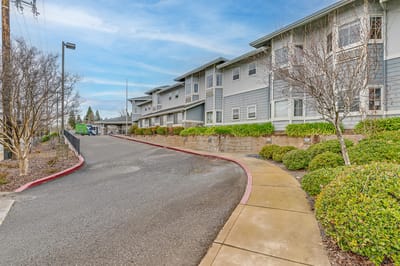 Exterior view of the facility with landscaped pathway