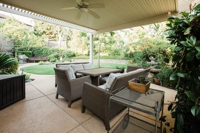 Cozy outdoor seating area with garden views