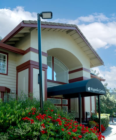 Exterior view of Magnolia Garden entrance with flowers