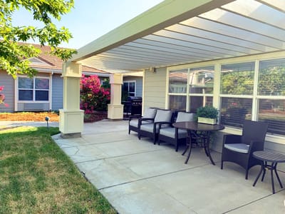 Outdoor seating area with blooming flowers