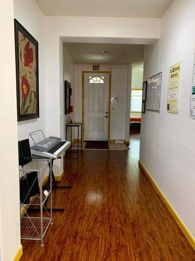 Interior hallway with door and keyboard