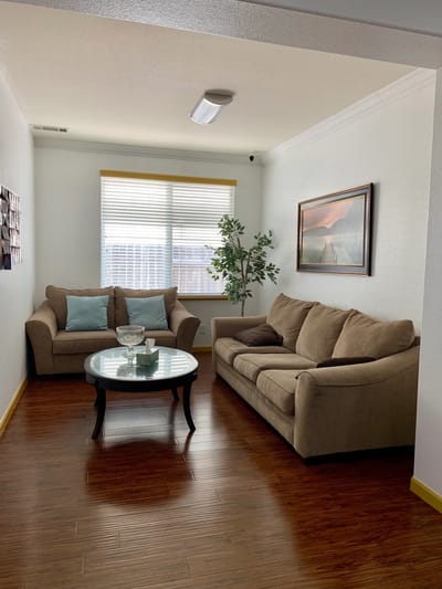 Cozy sitting area with couches and coffee table
