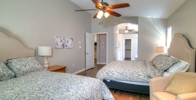 Brightly lit resident room with twin beds