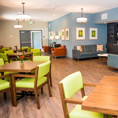 Bright common area with modern furniture and art