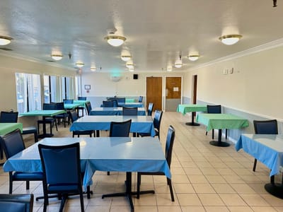Bright dining area with tables and chairs