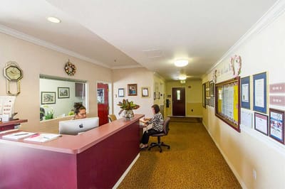 Reception area with staff and visitors